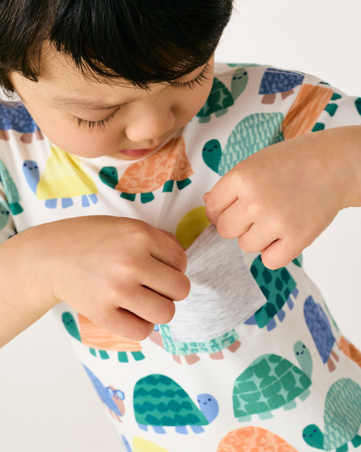 Close up of the pocket detail on the Shell Parade Relaxed Pocket Tee