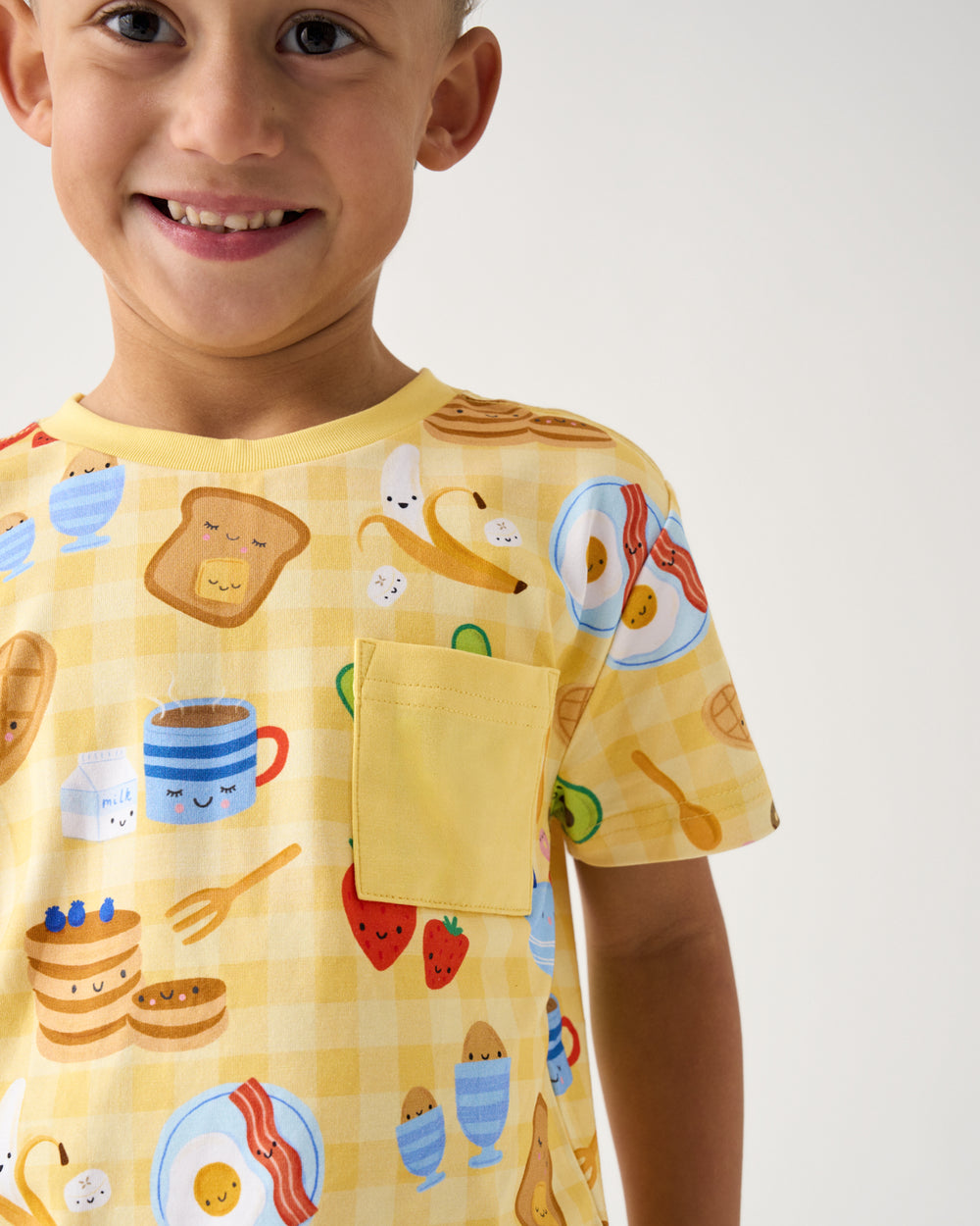 Close up of boy wearing the Breakfast Bunch Relaxed Pocket Tee