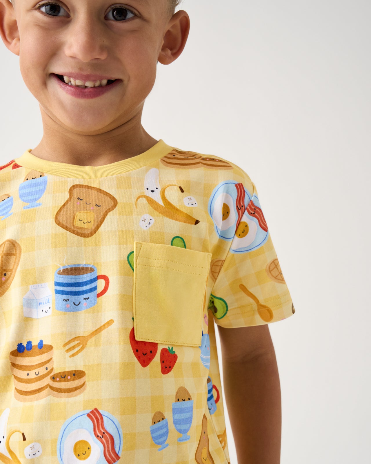 Close up of boy wearing the Breakfast Bunch Relaxed Pocket Tee