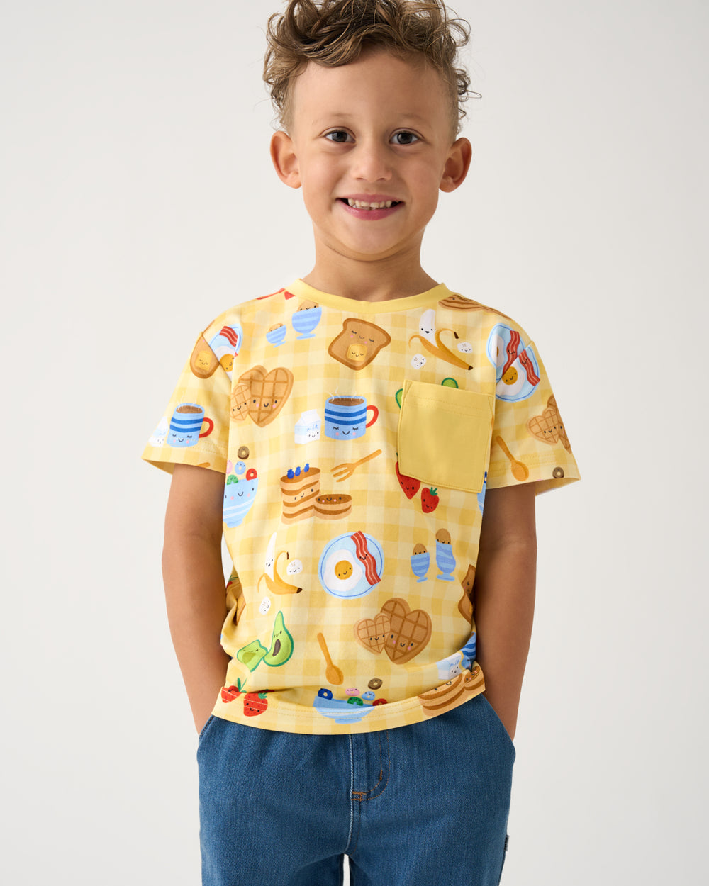 Boy wearing the Breakfast Bunch Relaxed Pocket Tee with denim pants