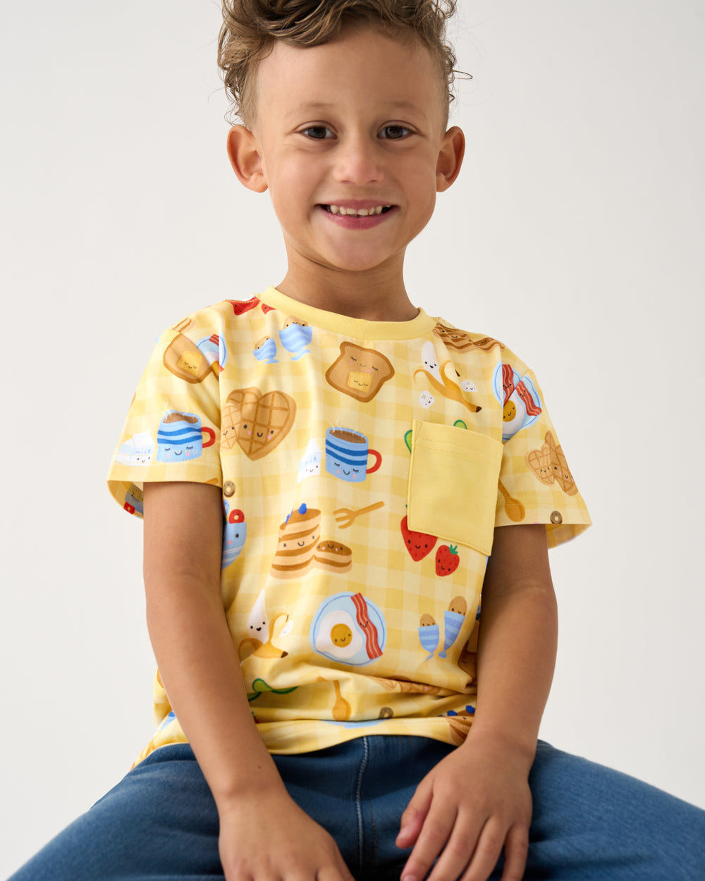 Boy wearing the Breakfast Bunch Relaxed Pocket Tee with joggers