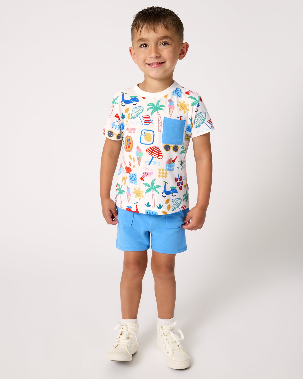 Boy wearing the Blue Bolt Shorts with a Ciao Bella print tee