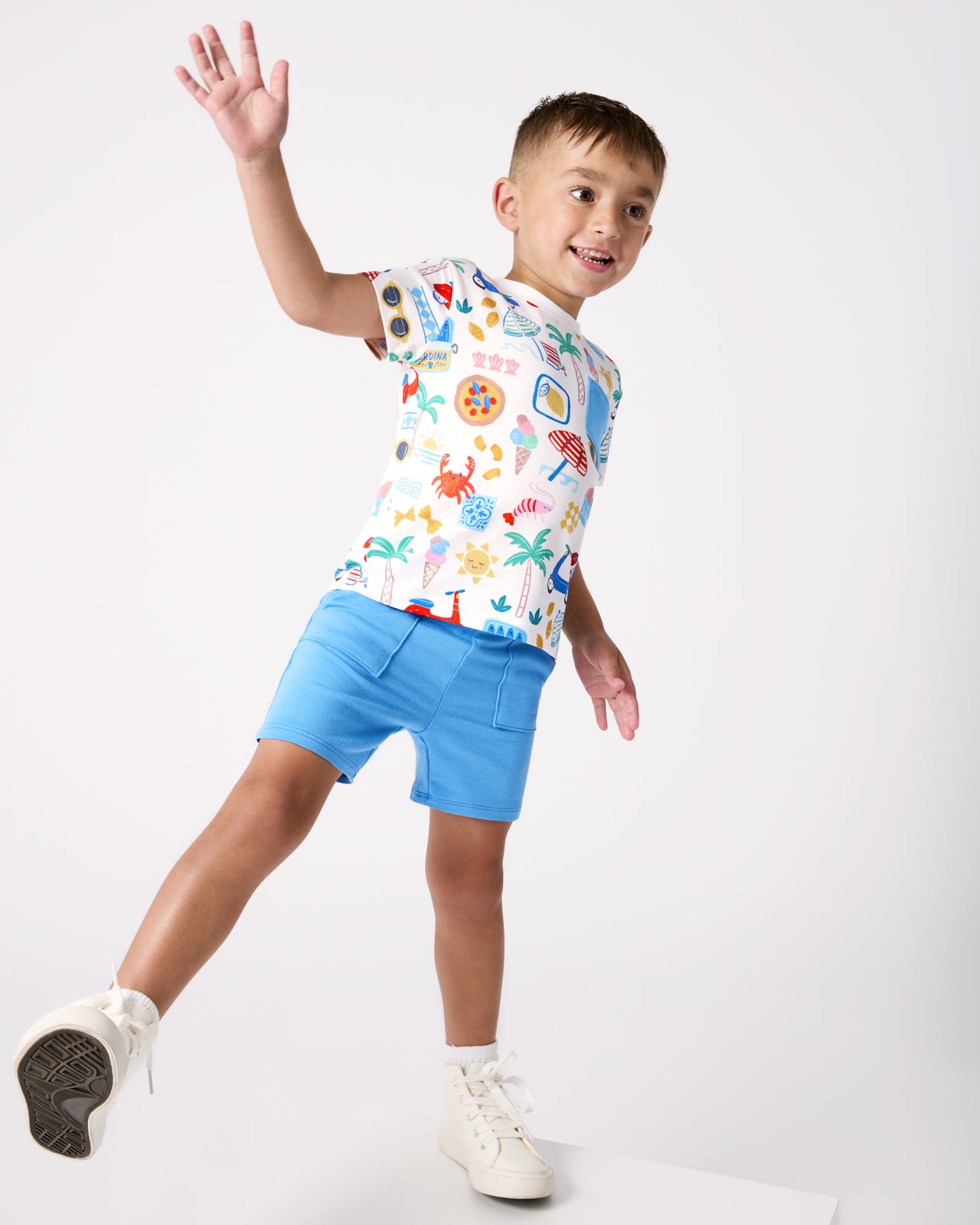 Child in motion wearing the Blue Bolt Shorts and Ciao Bella Relaxed Pocket Tee