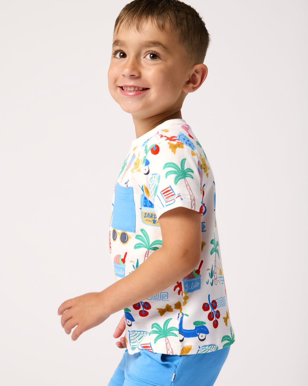 Side view of boy wearing the Ciao Bella Relaxed Pocket Tee