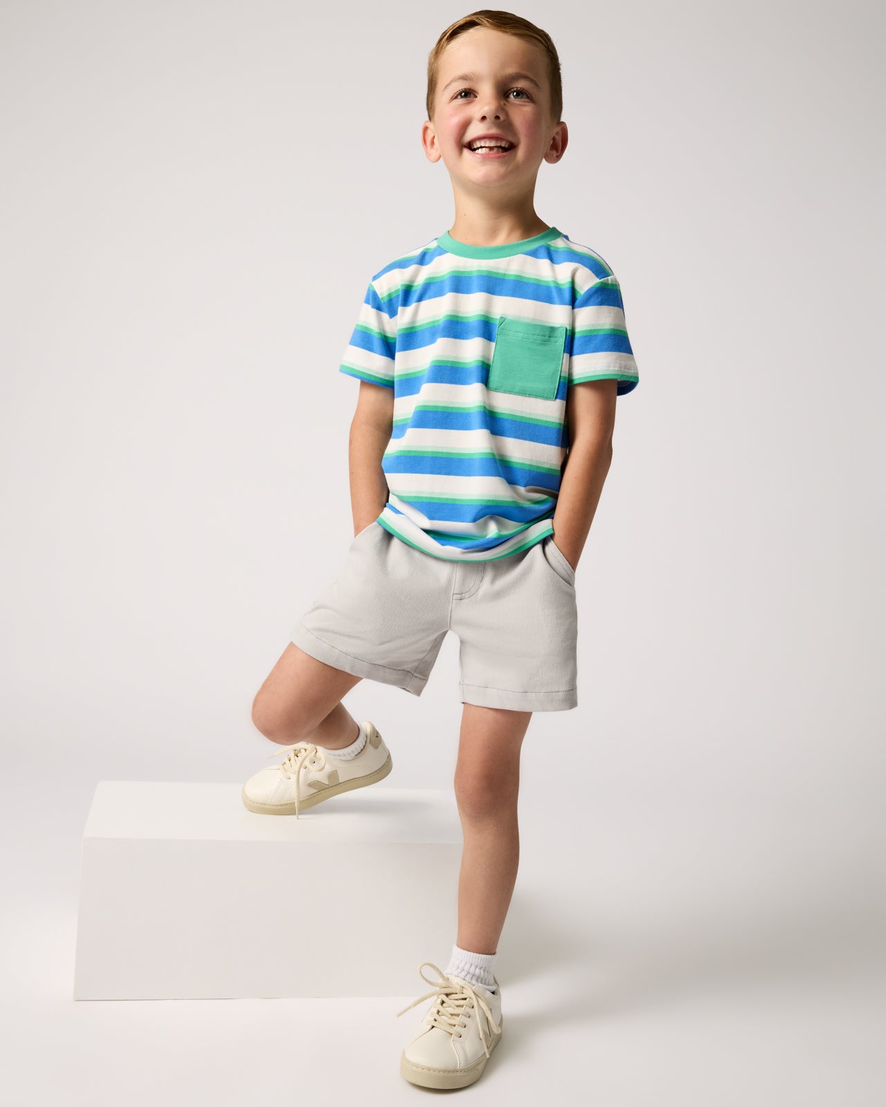 Boy wearing the Blue Bolt Stripes Relaxed Pocket Tee 