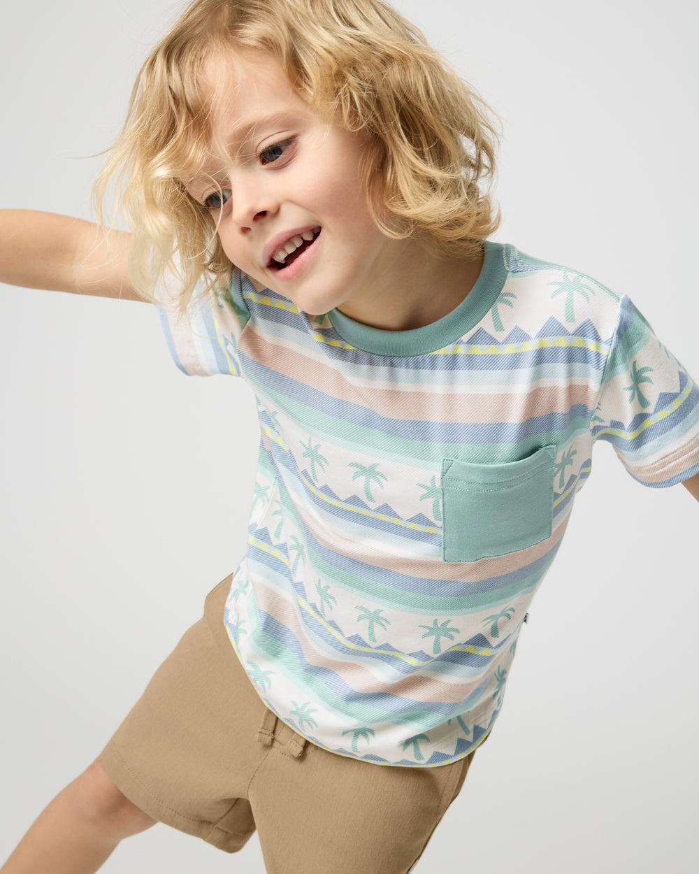 Child in motion wearing the Swell Stripes Relaxed Pocket Tee