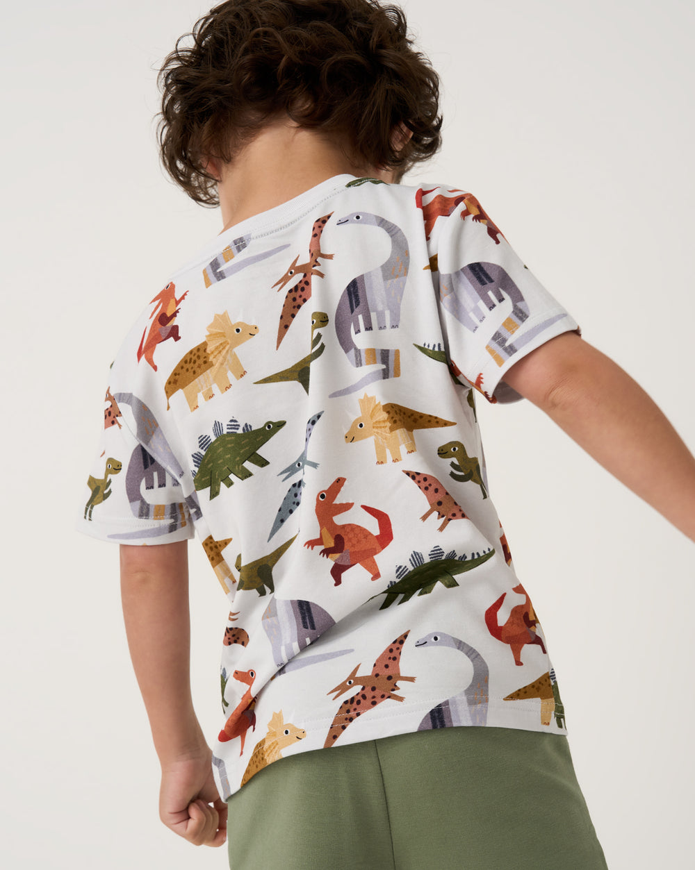 Back view of boy wearing the Roar & Explore Relaxed Pocket Tee