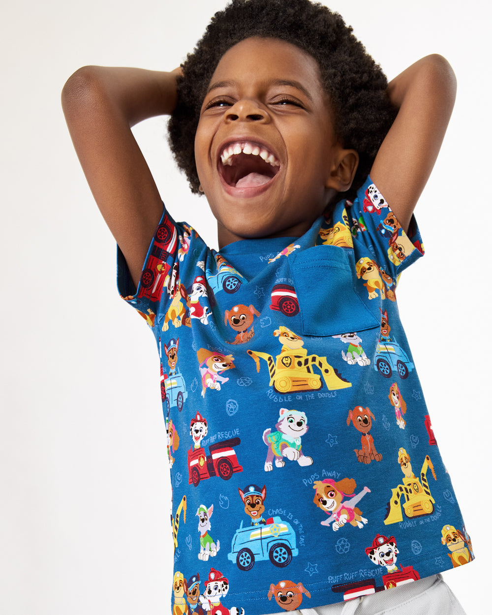 Boy wearing the PAW Patrol Adventure Bay Heroes Relaxed Pocket Tee