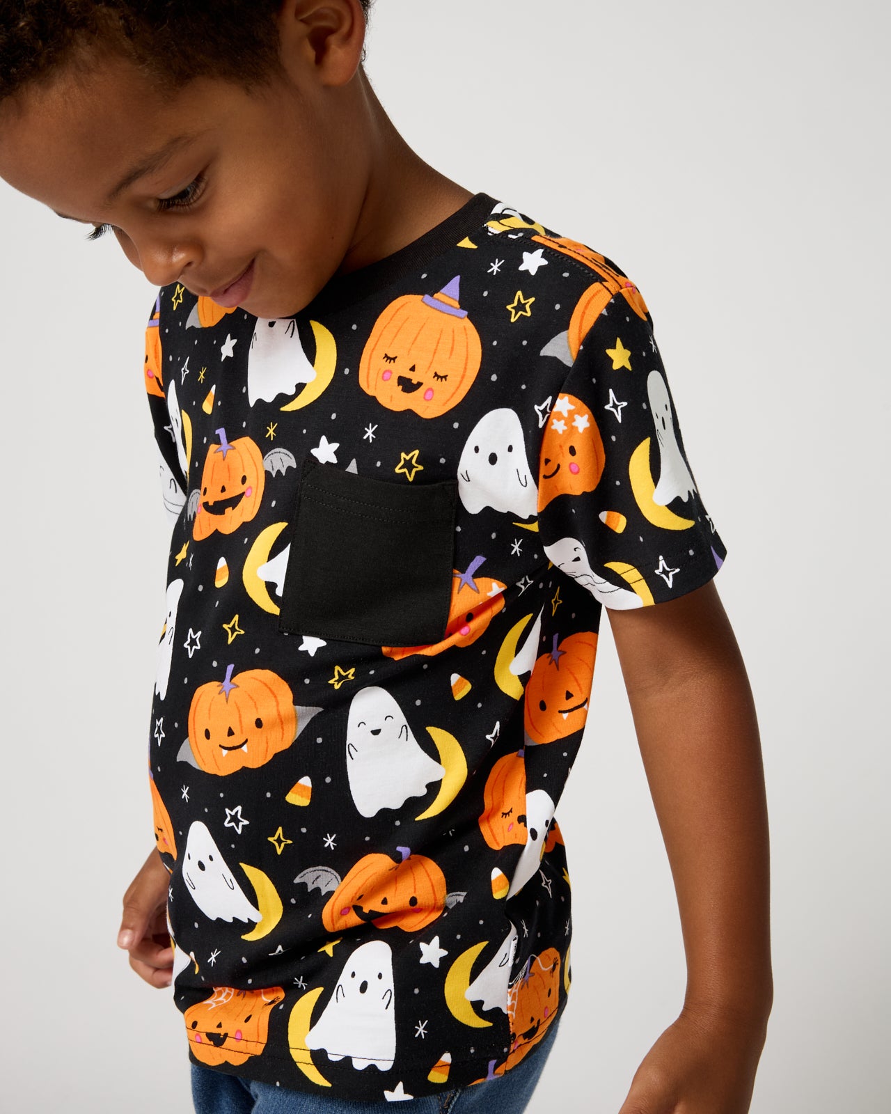 Close up of boy wearing the Moonlit Magic Relaxed Pocket Tee
