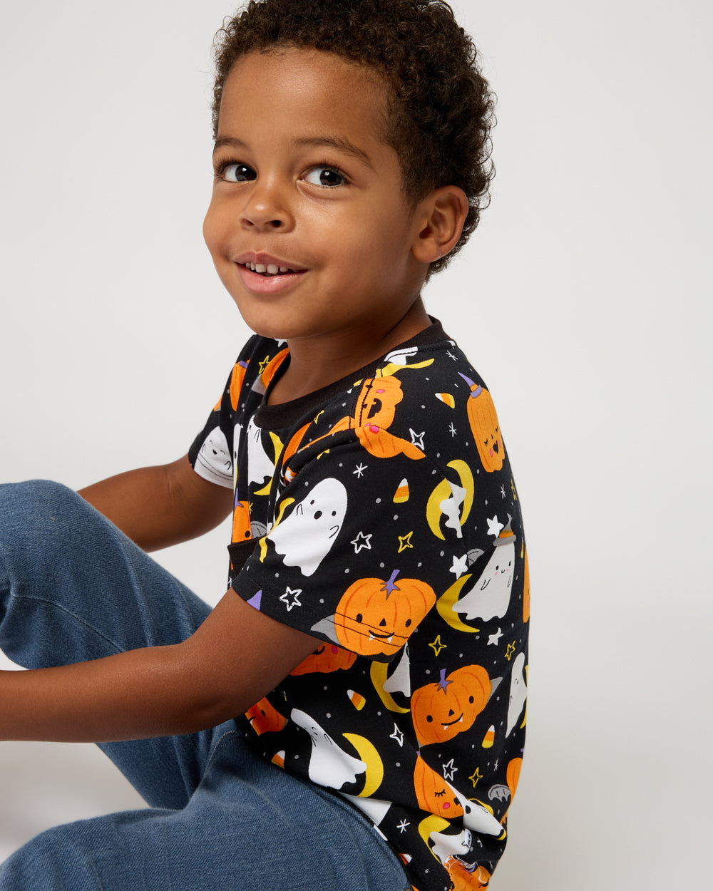 Boy wearing the Moonlit Magic Relaxed Pocket Tee with denim pants