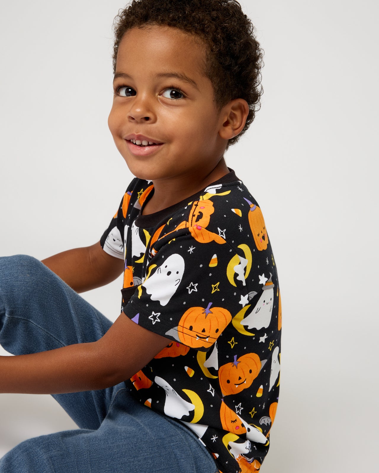 Boy wearing the Moonlit Magic Relaxed Pocket Tee with denim pants