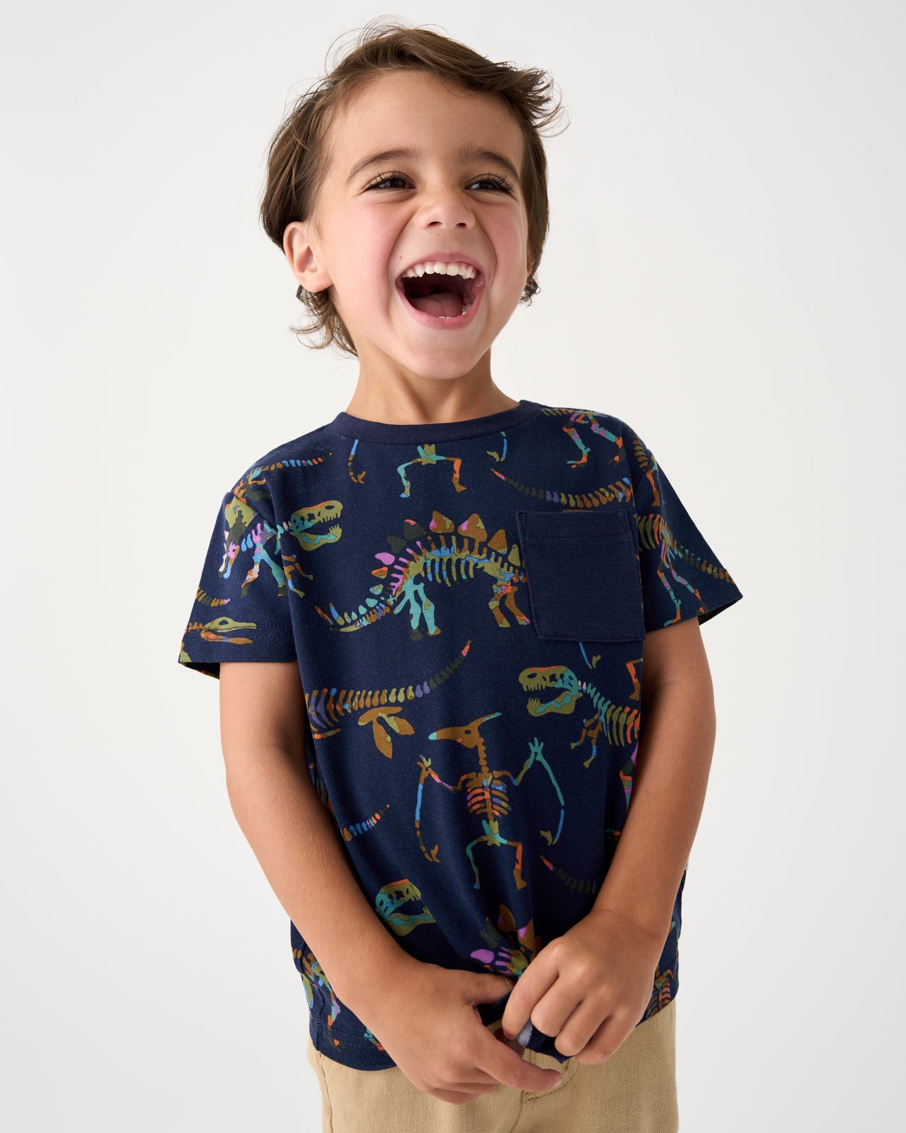 Close up of boy wearing the Fossil Quest Relaxed Pocket Tee