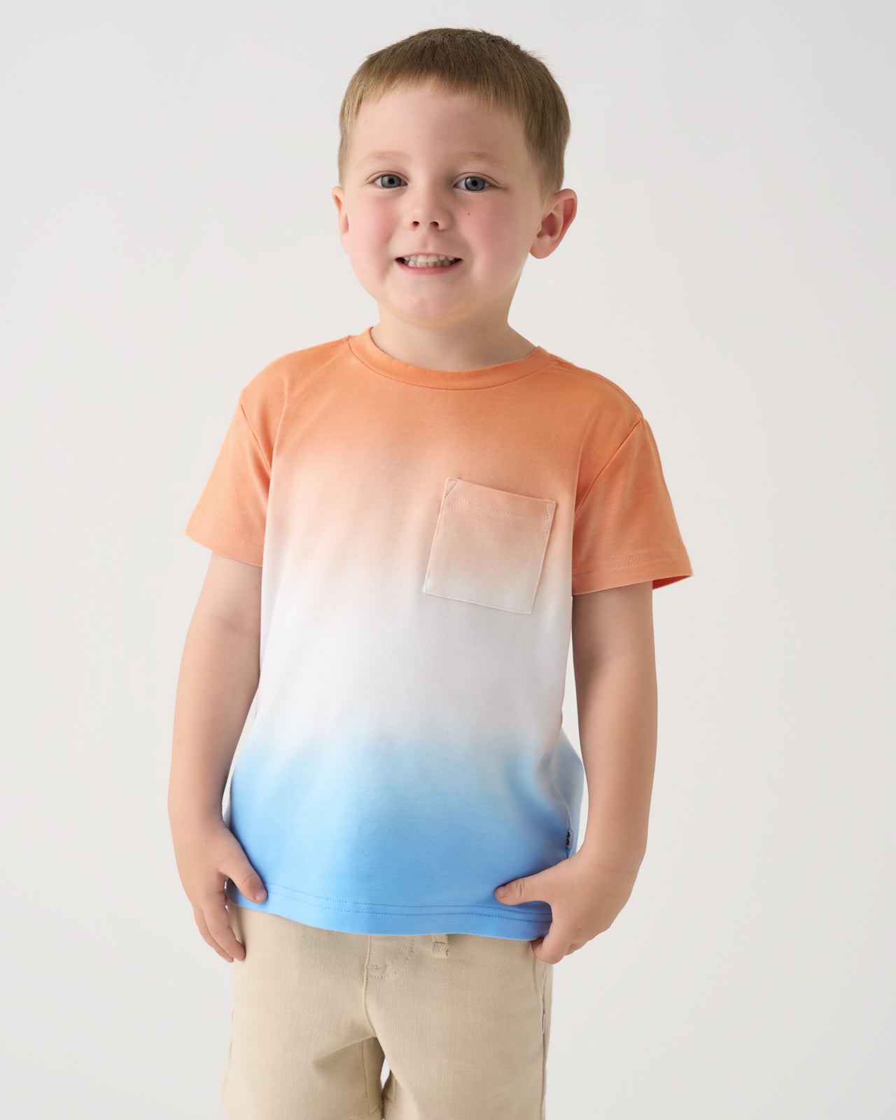Boy wearing the Orange Crush Relaxed Pocket Tee