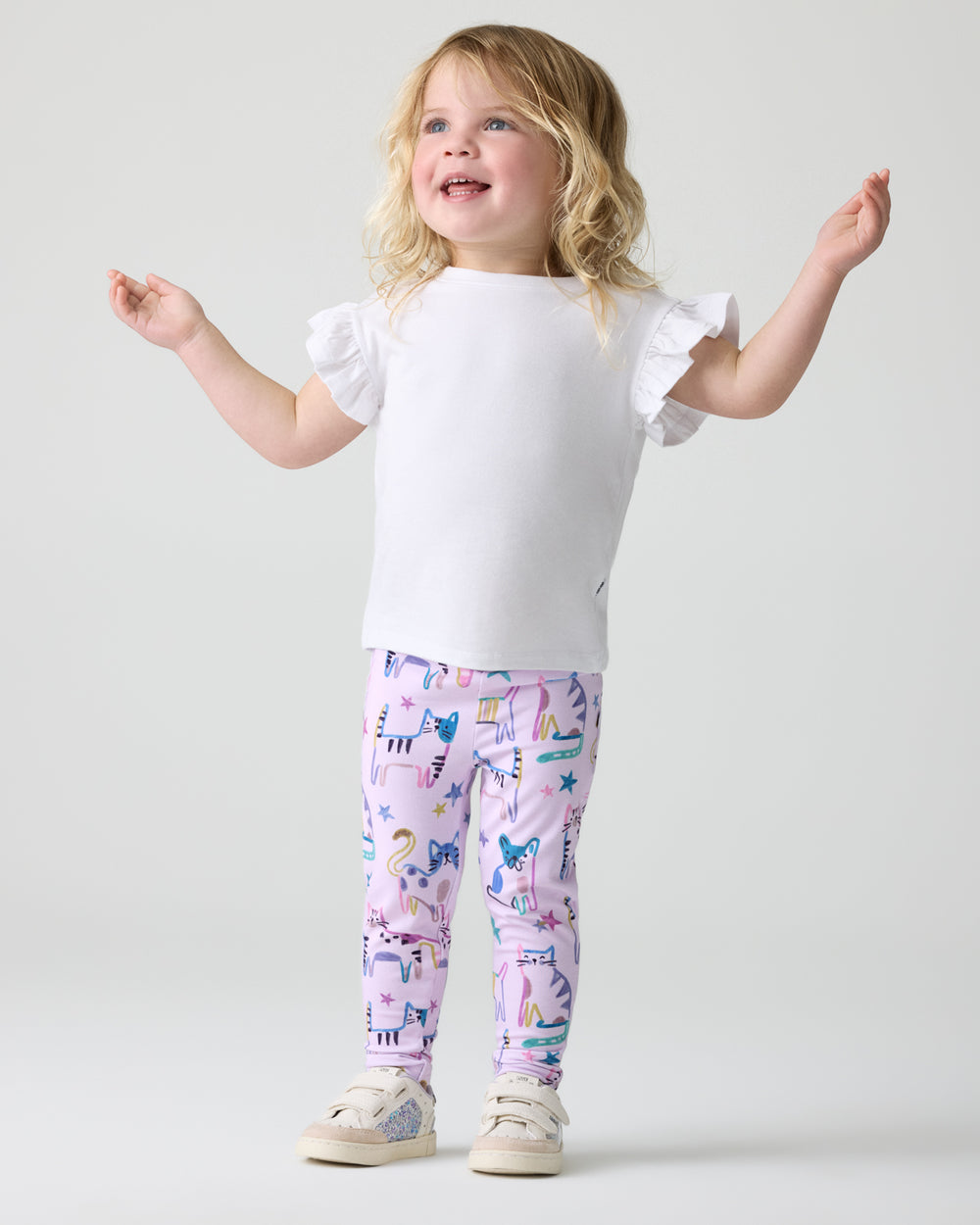 Girl wearing the Whiskers & Wags Purple Legging with a white flutter tee