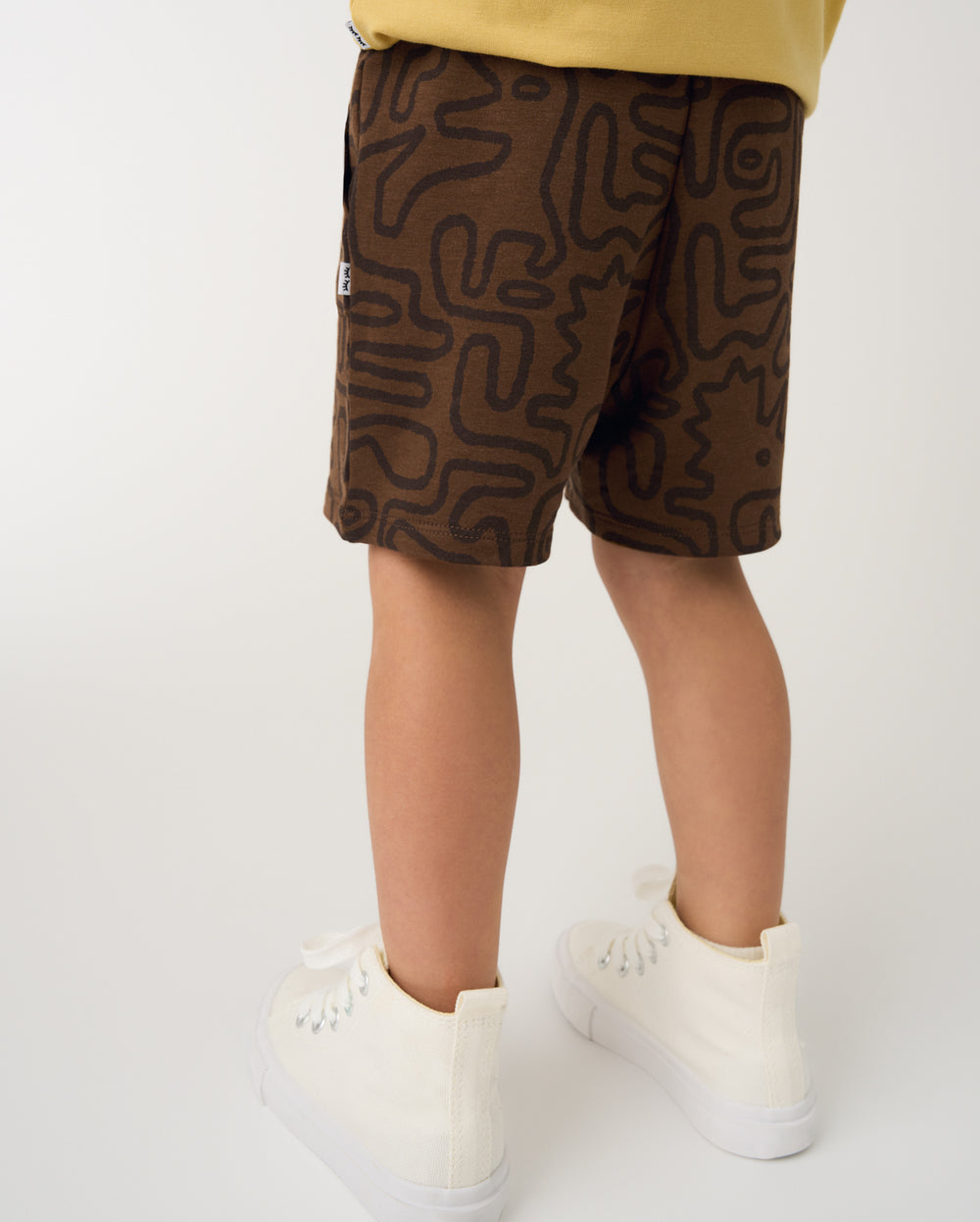 Back view of boy wearing the Dino Maze Shorts