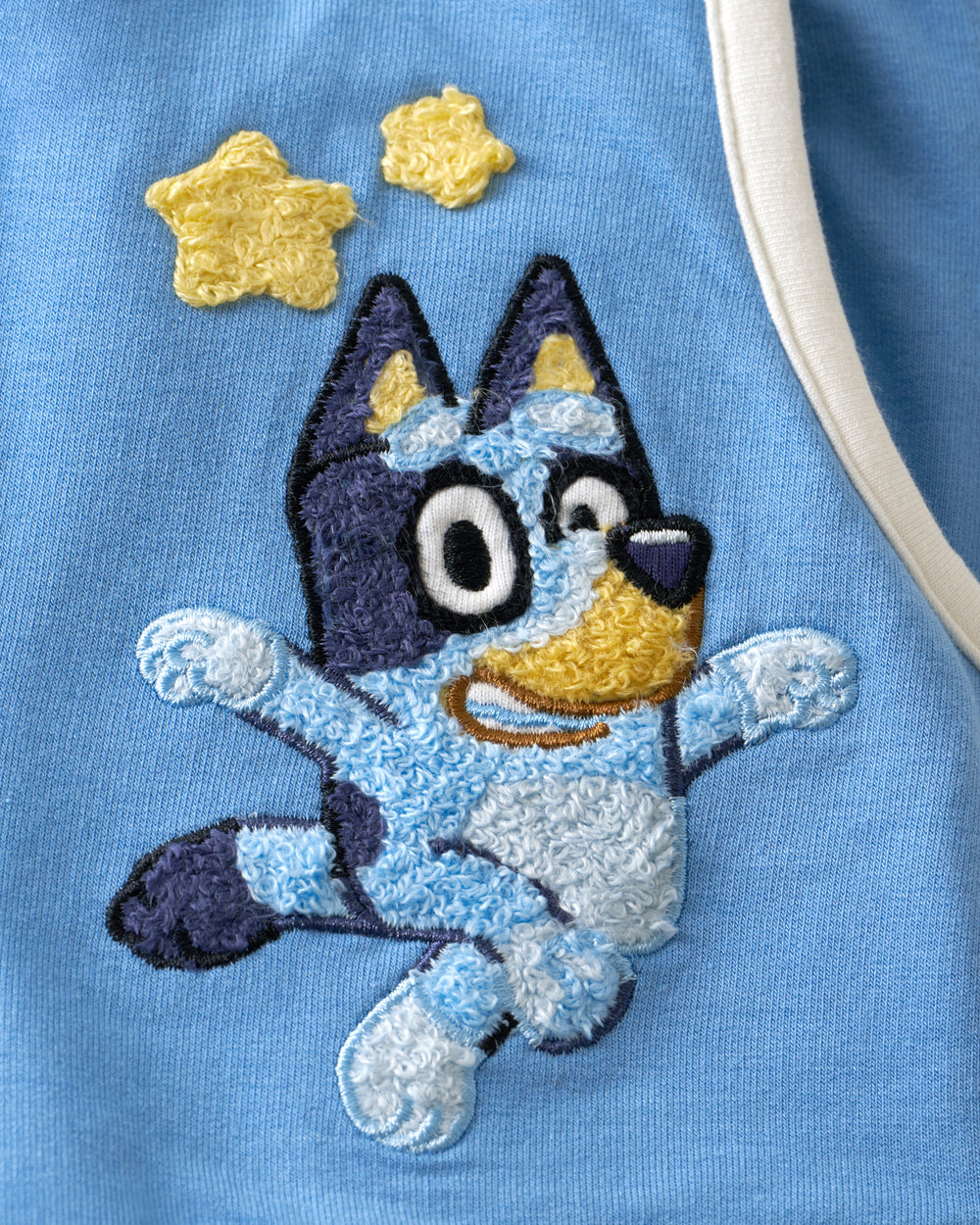 Close up of the embroidered Bluey on the Bluey Best Day Ever Dolphin Shorts