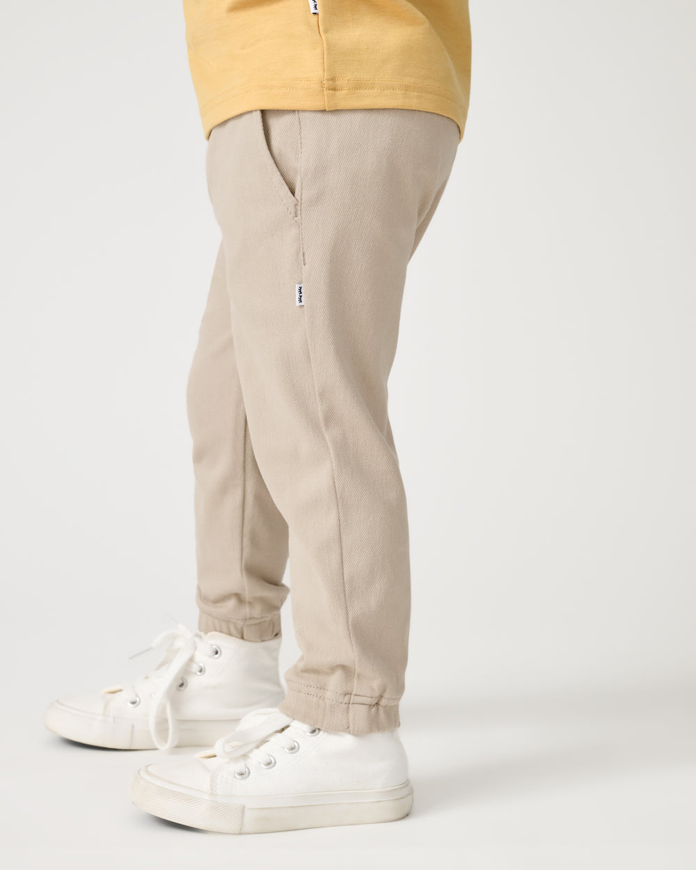 Side view of child wearing the Sand Drift Denim Jogger