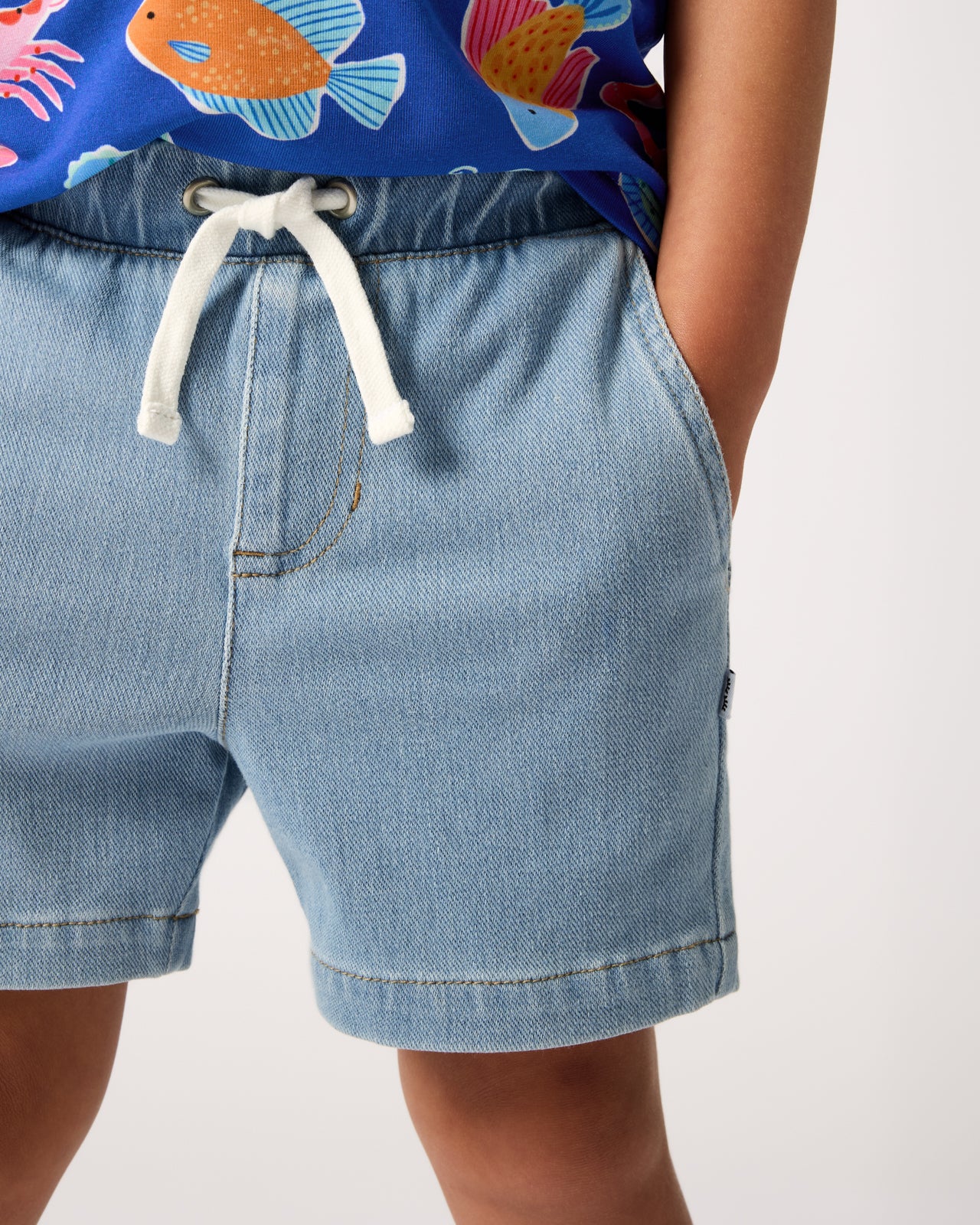 Close up of the pocket detail on the Light Denim Chino Shorts