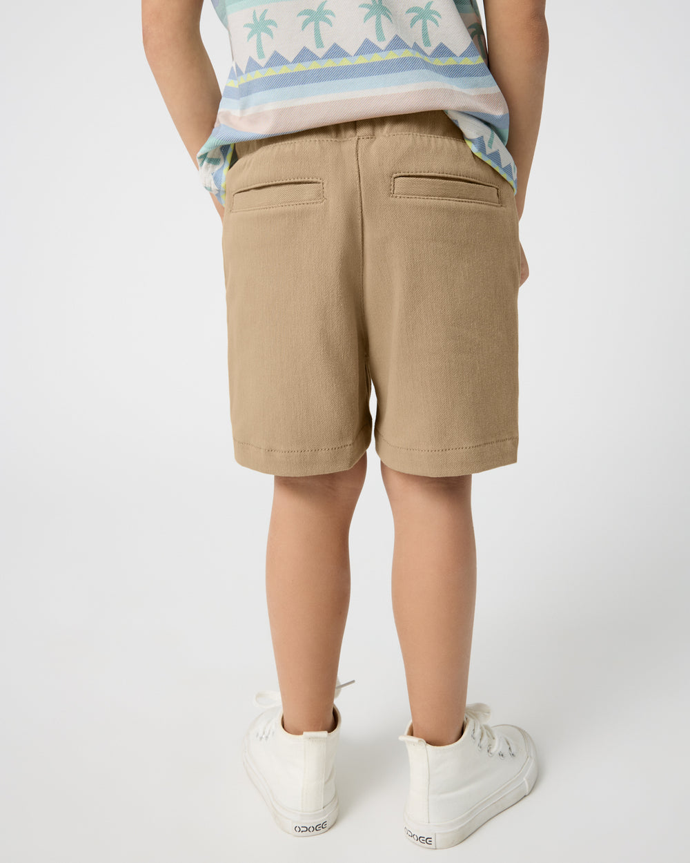 Back view of boy wearing the Toasted Hazelnut Chino Shorts