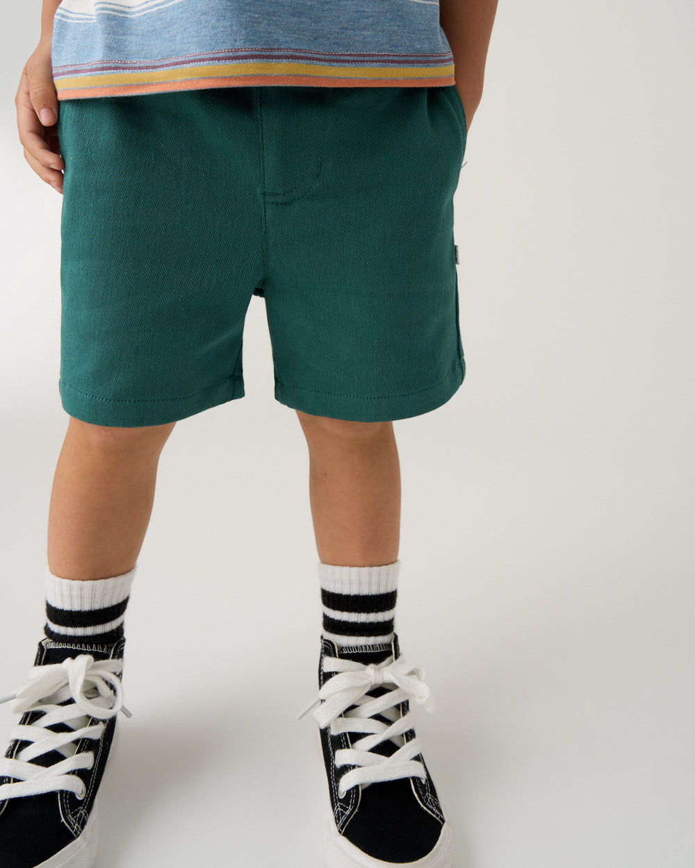 Close up of boy wearing the Muted Spruce Chino Shorts