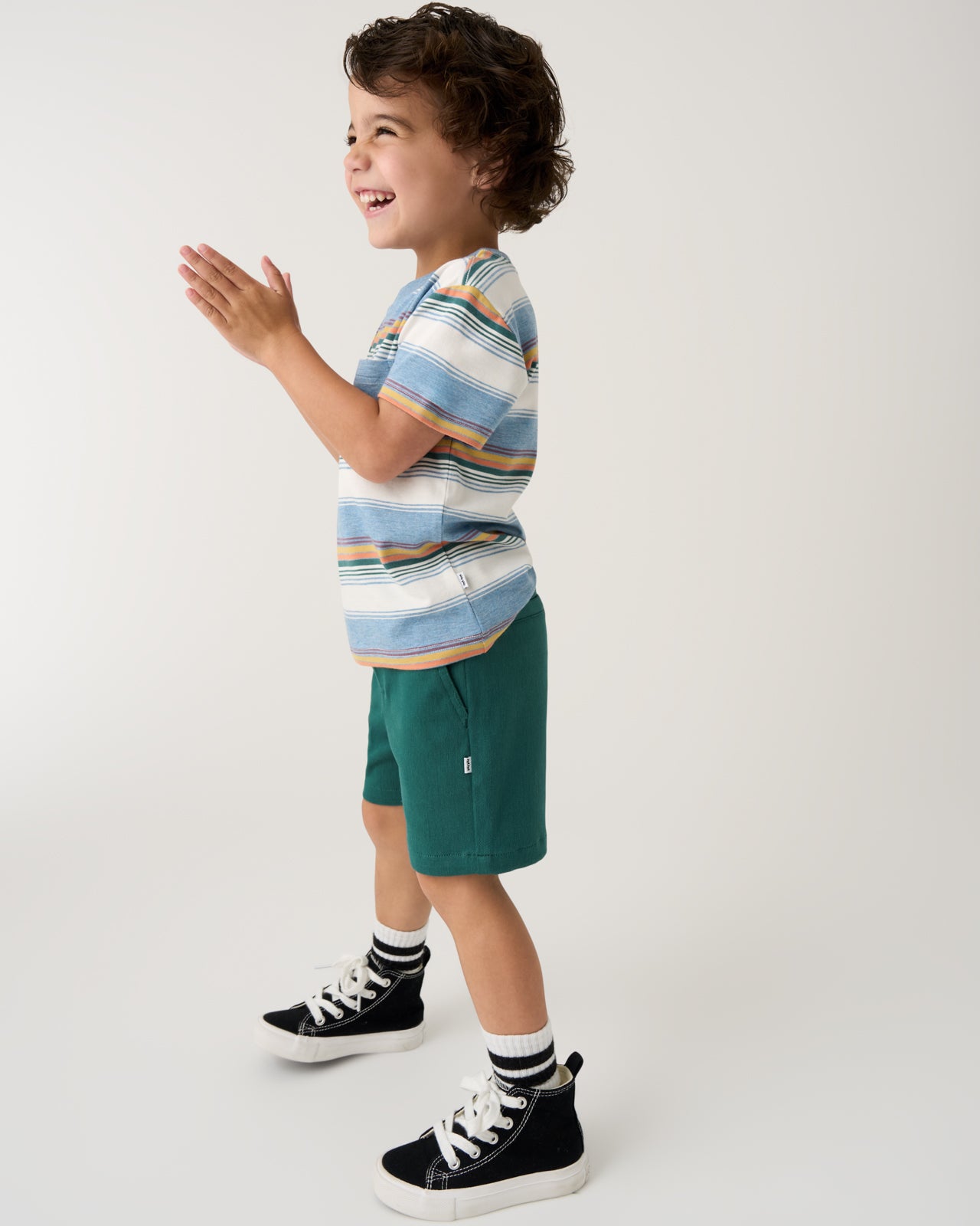 Boy wearing the Muted Spruce Chino Shorts with a striped tee
