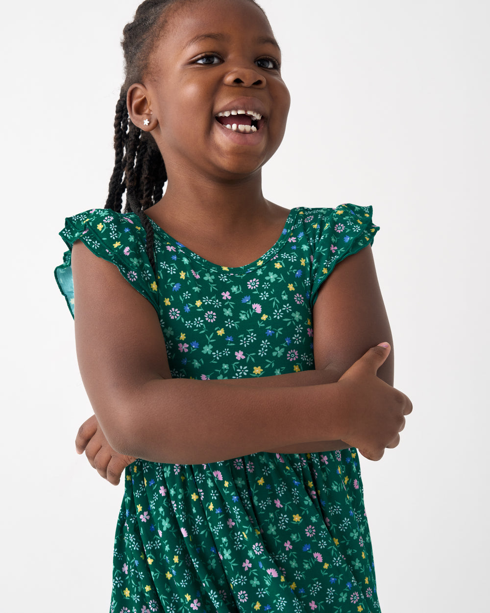 Close up of girl wearing the Emerald Meadow Flutter Twirl Dress