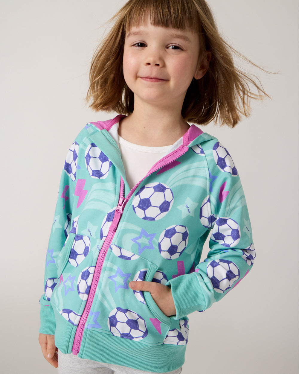 Close up of girl wearing the Aqua Soccer Stars Zip Hoodie