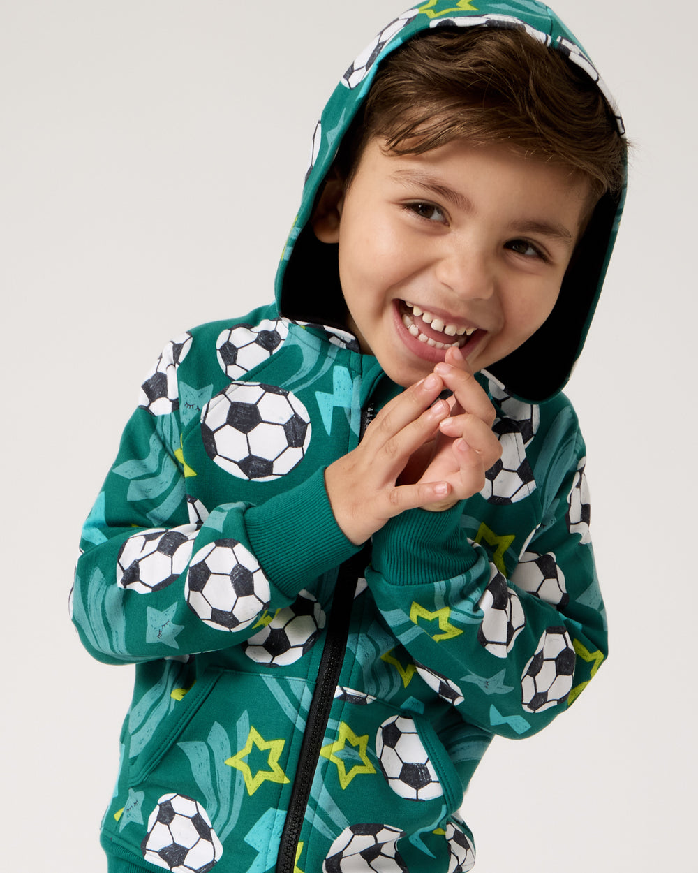 Close up of boy wearing the Soccer Stars Zip Hoodie with the hood on