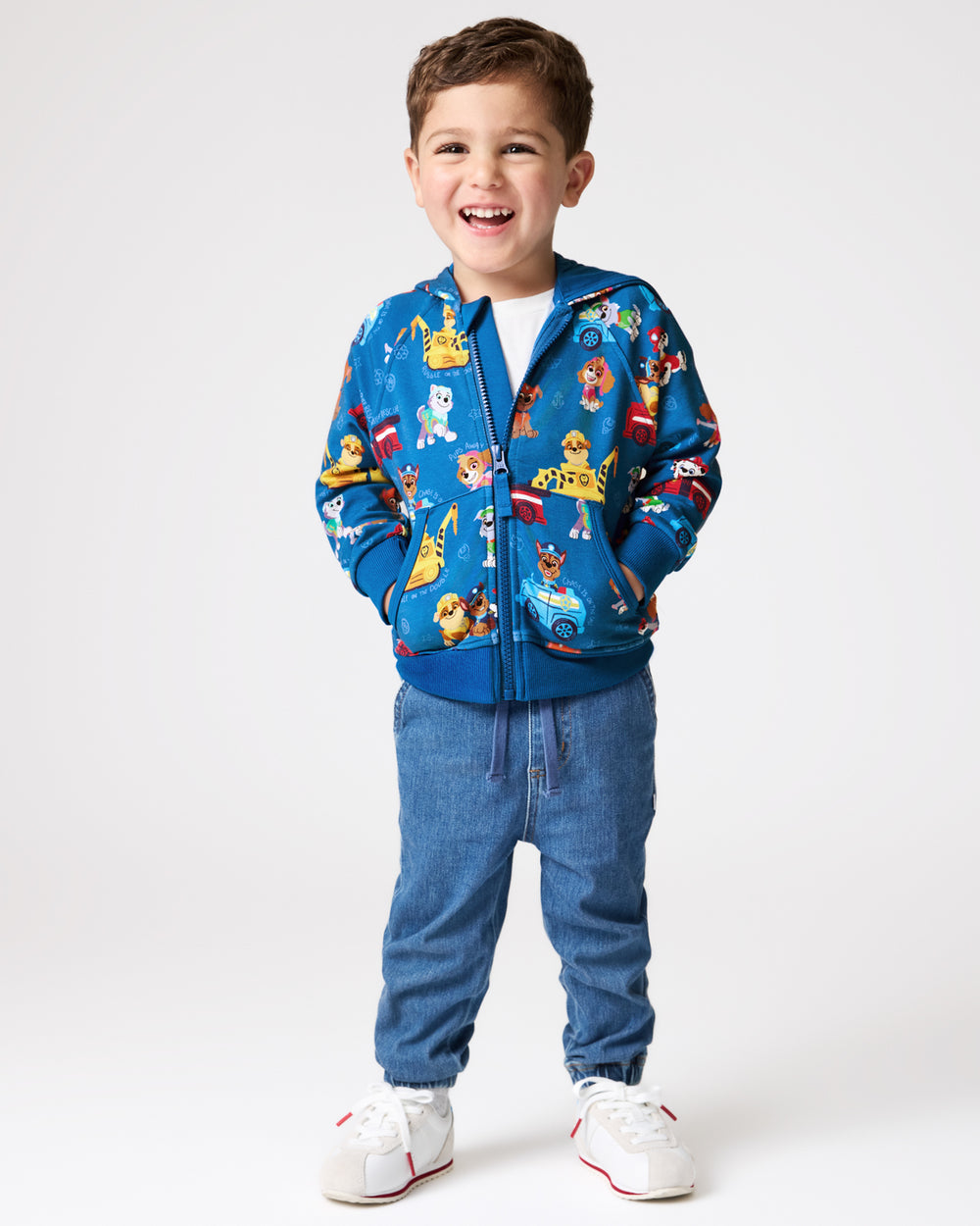 Boy wearing the PAW Patrol Adventure Bay Heroes Zip Hoodie and denim joggers