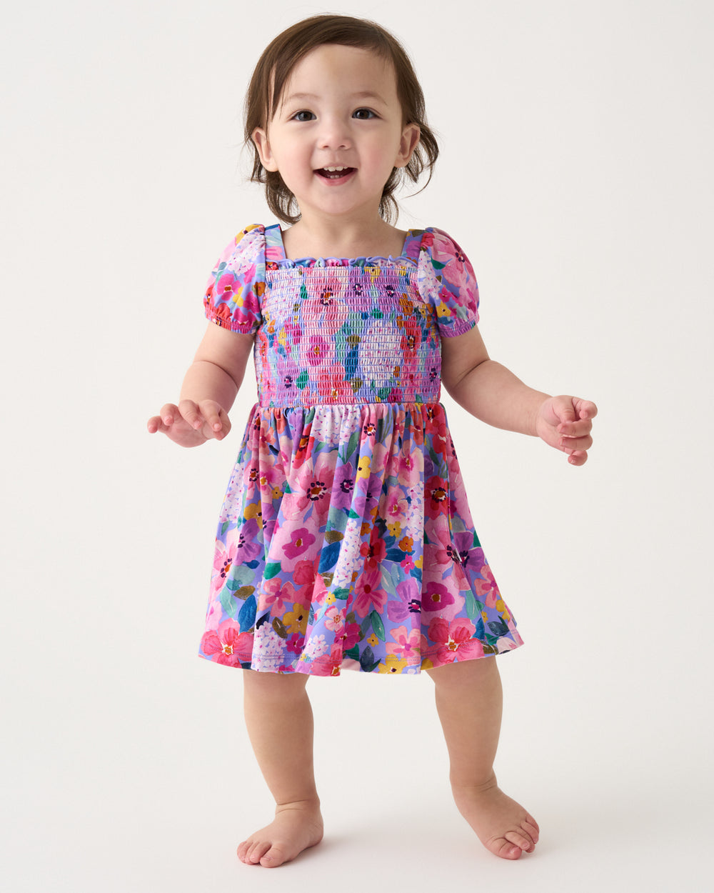 Toddler wearing the Sweet Sprigs Puff Sleeve Smocked Dress with Bloomer