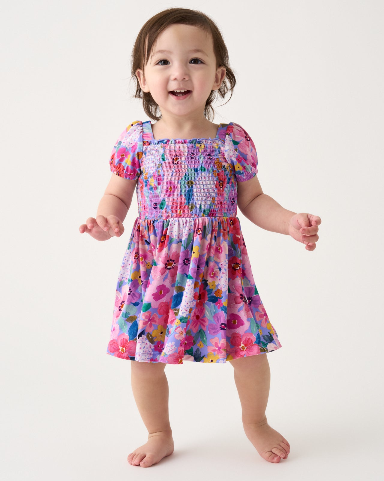 Toddler wearing the Sweet Sprigs Puff Sleeve Smocked Dress with Bloomer