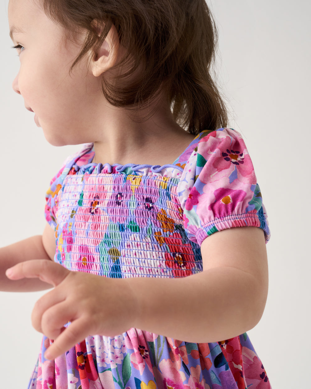 Close up of the smocked details on the Sweet Sprigs Puff Sleeve Smocked Dress with Bloomer