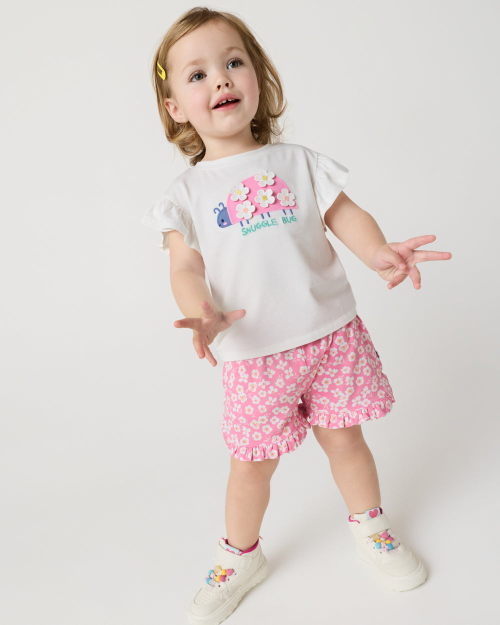 Child wearing the Sweet Pink Petals Ruffle Shorts