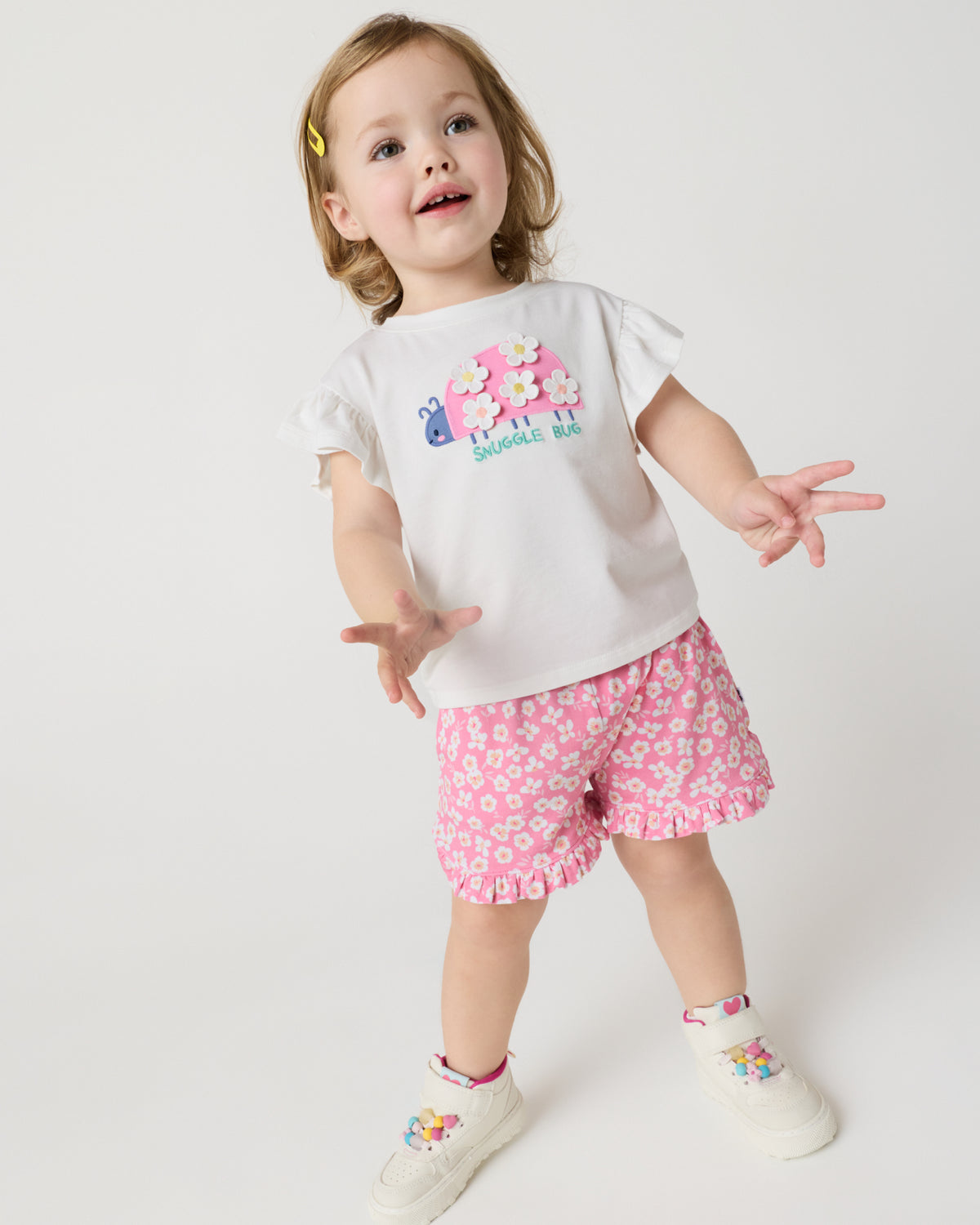 Child wearing the Sweet Pink Petals Ruffle Shorts