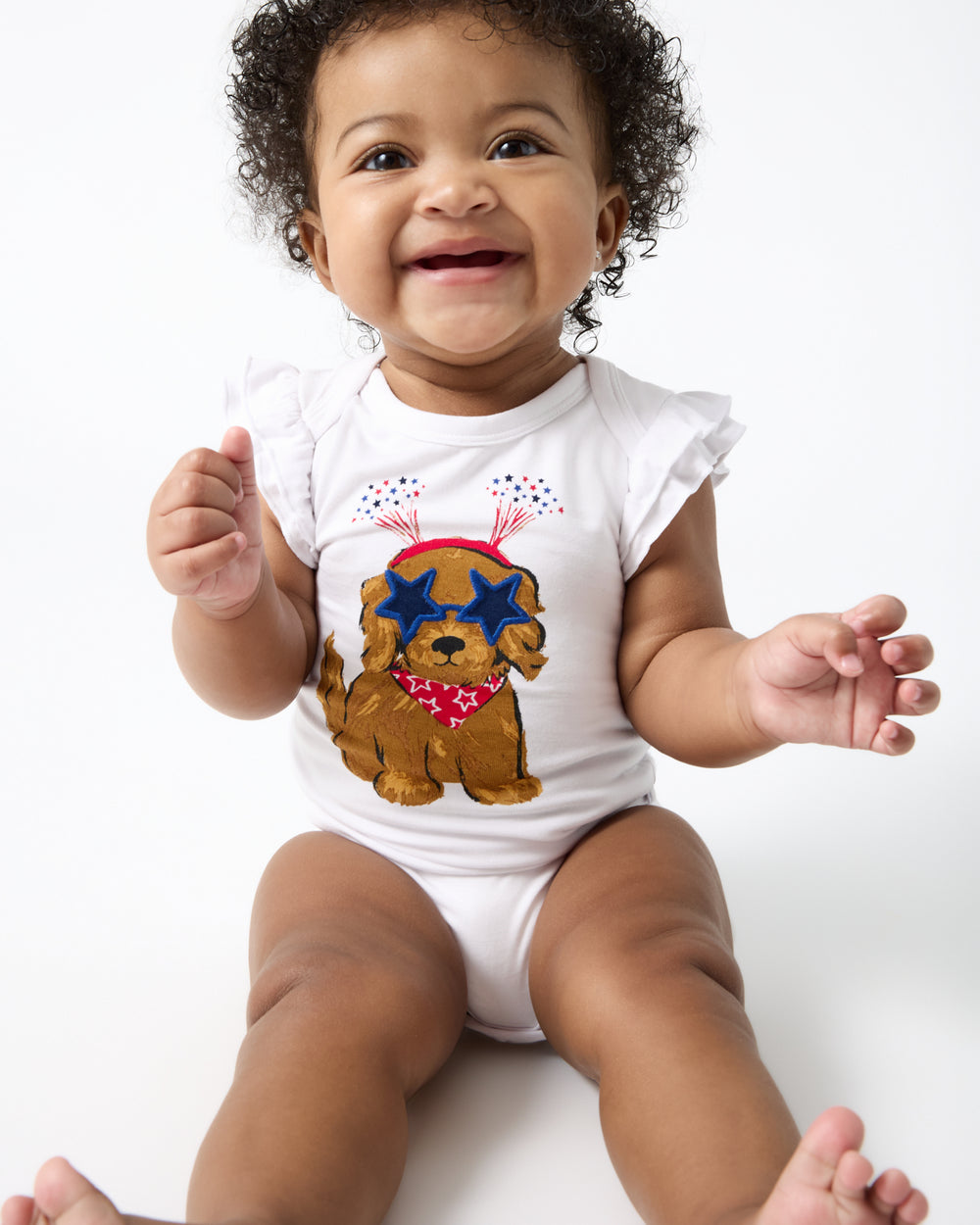 Alternate of sitting baby wearing the Star Spangled Pup Flutter Bodysuit