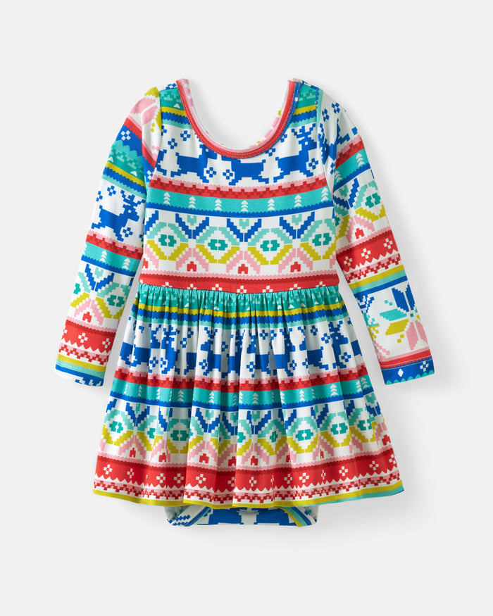 A long-sleeve baby dress with a colorful Fair Isle pattern featuring blue, red, green, yellow, and pink geometric designs on a white background.