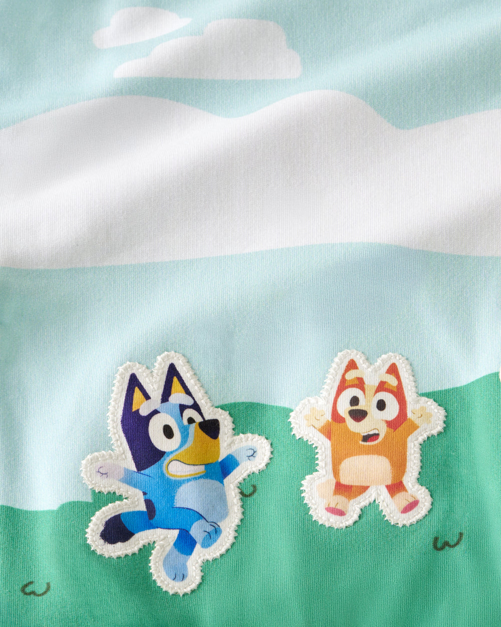 Close up of the Bluey and Bingo graphics on the Bluey The Heeler House Drop Shoulder Crewneck