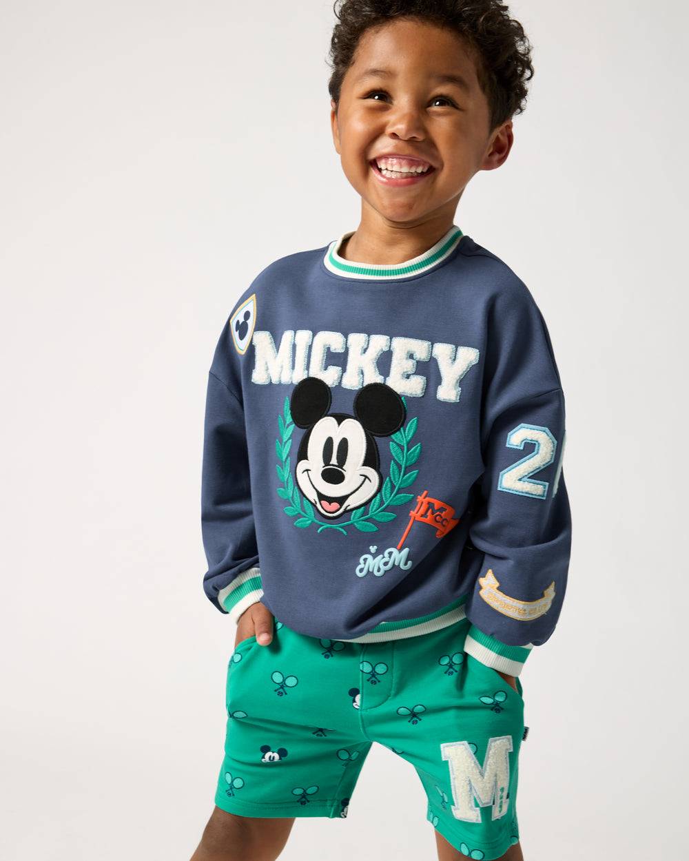 Boy wearing the Disney Mickey Mouse Sports Club Drop Shoulder Crewneck