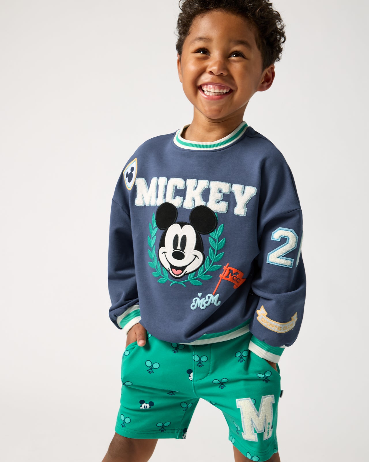 Boy wearing the Disney Mickey Mouse Sports Club Drop Shoulder Crewneck