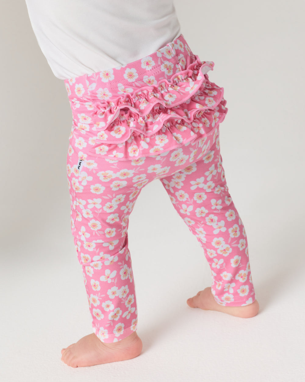 Back view of baby wearing the Sweet Pink Petals Ruffle Legging