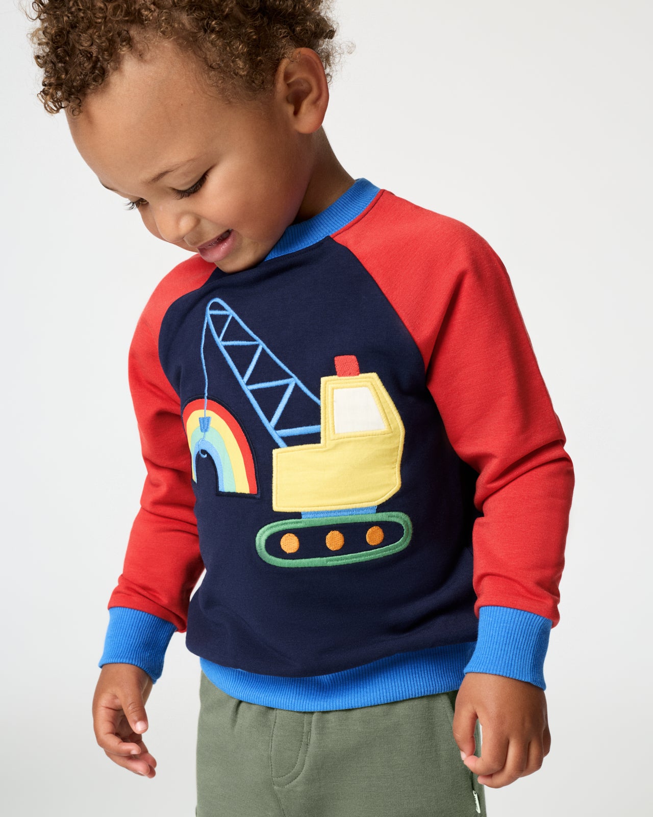 Boy wearing the Rainbow Trucks Crewneck Sweatshirt