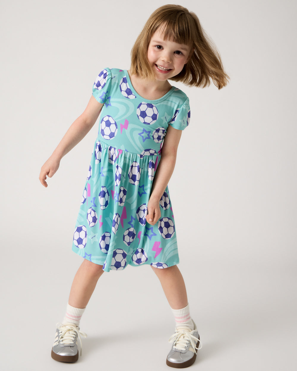 Girl wearing the Aqua Soccer Stars Skater Dress
