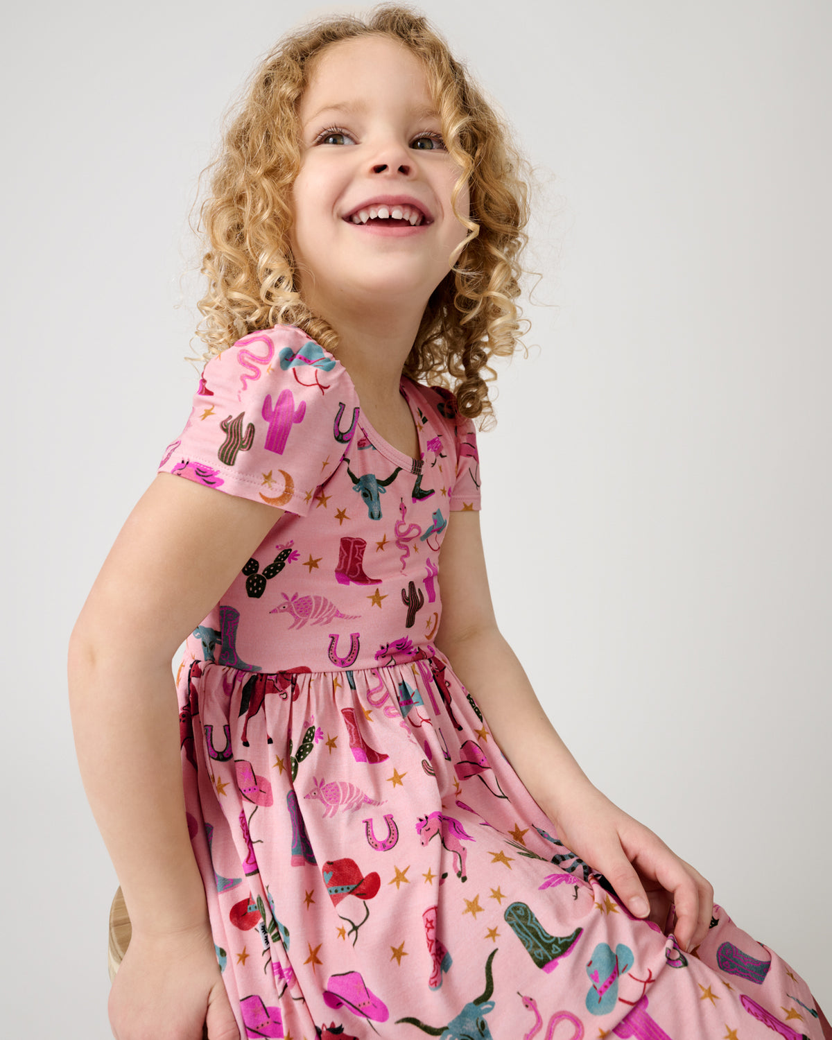 Close up of girl wearing the Pink Rancher Roundup Skater Dress