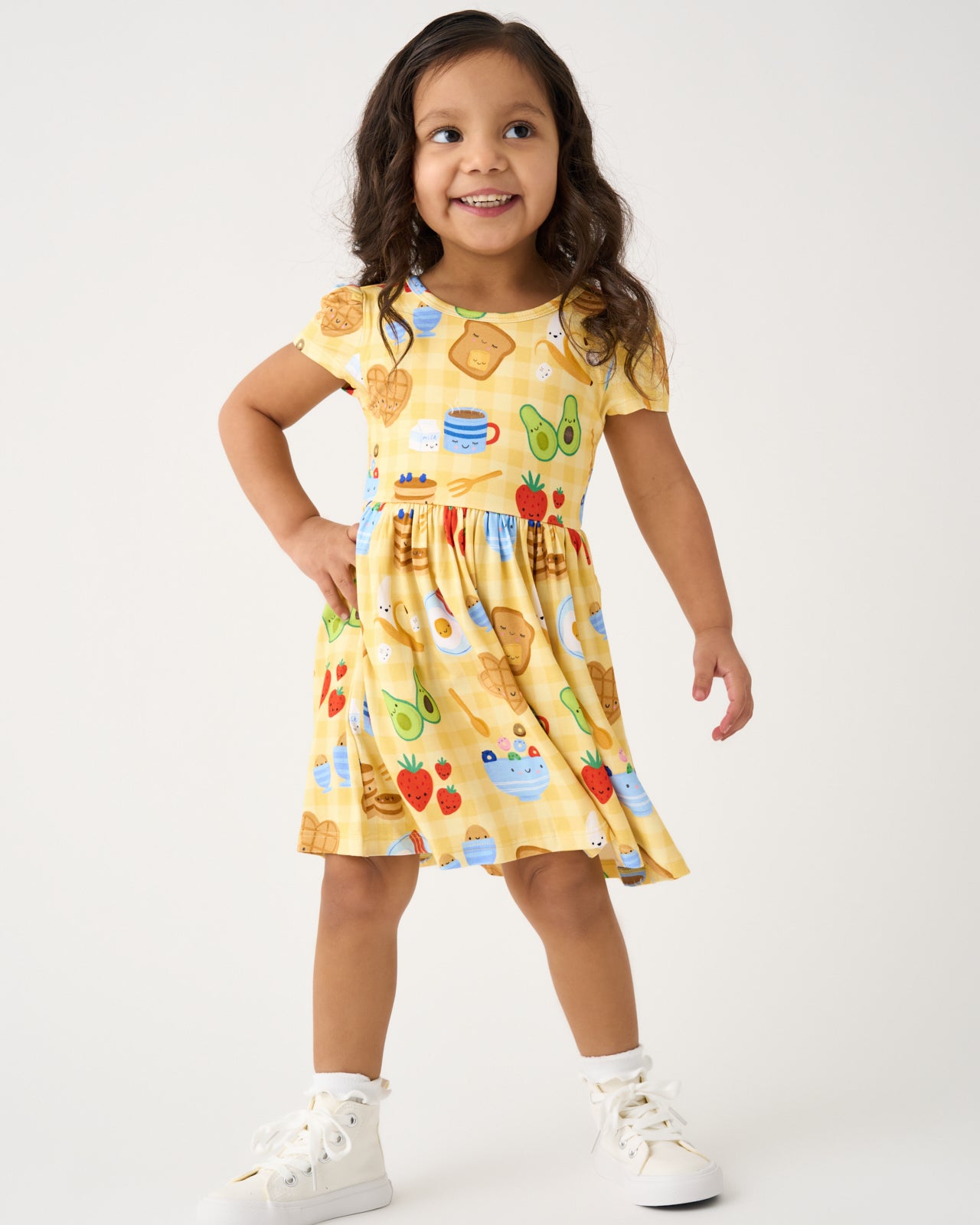 Standing girl wearing the Breakfast Bunch Skater Dress