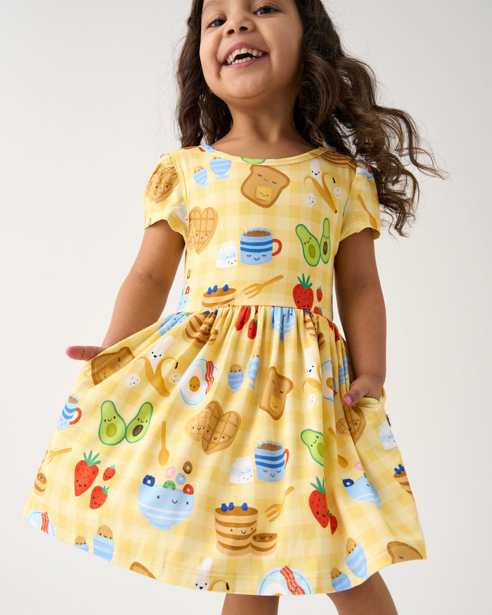 Close up of girl wearing the Breakfast Bunch Skater Dress