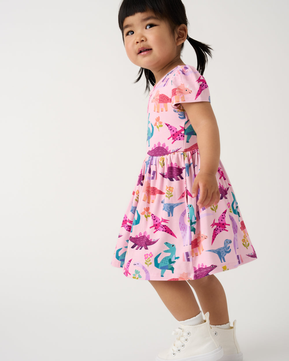 Walking child wearing the Roar & Explore Skater Dress