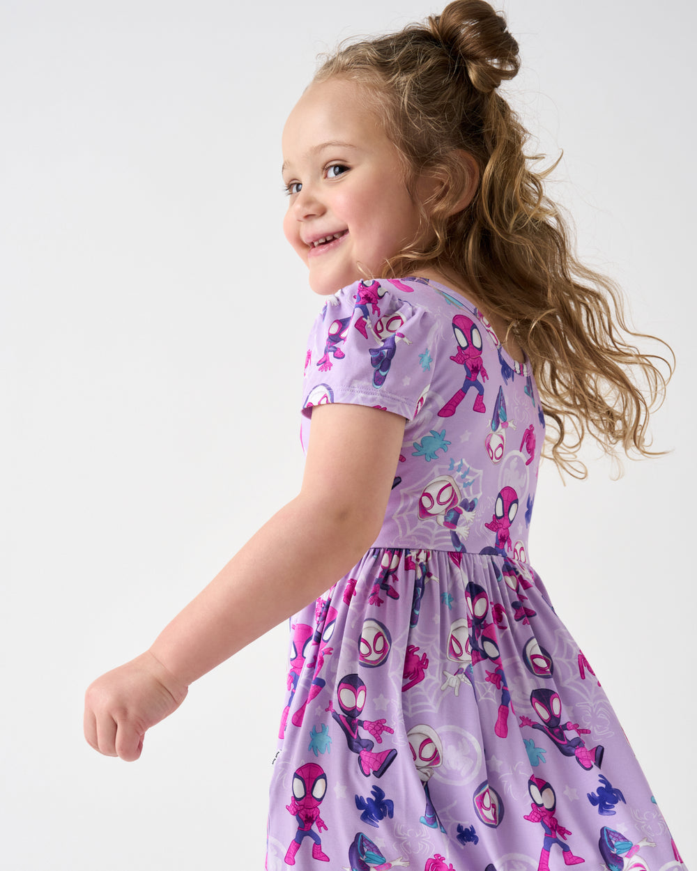 Close up of girl wering the Spidey & Friends Tiny Webs Skater Dress