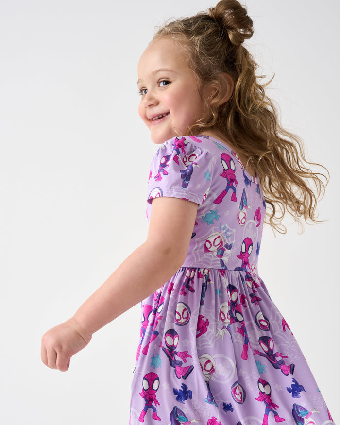 Close up of girl wering the Spidey & Friends Tiny Webs Skater Dress