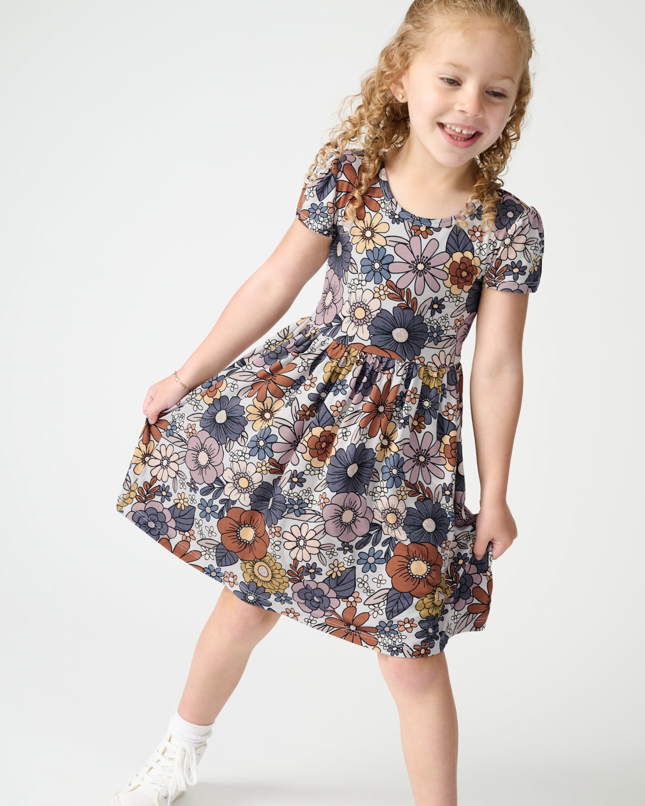 Close up of girl wearing the Wildwood Floral Skater Dress