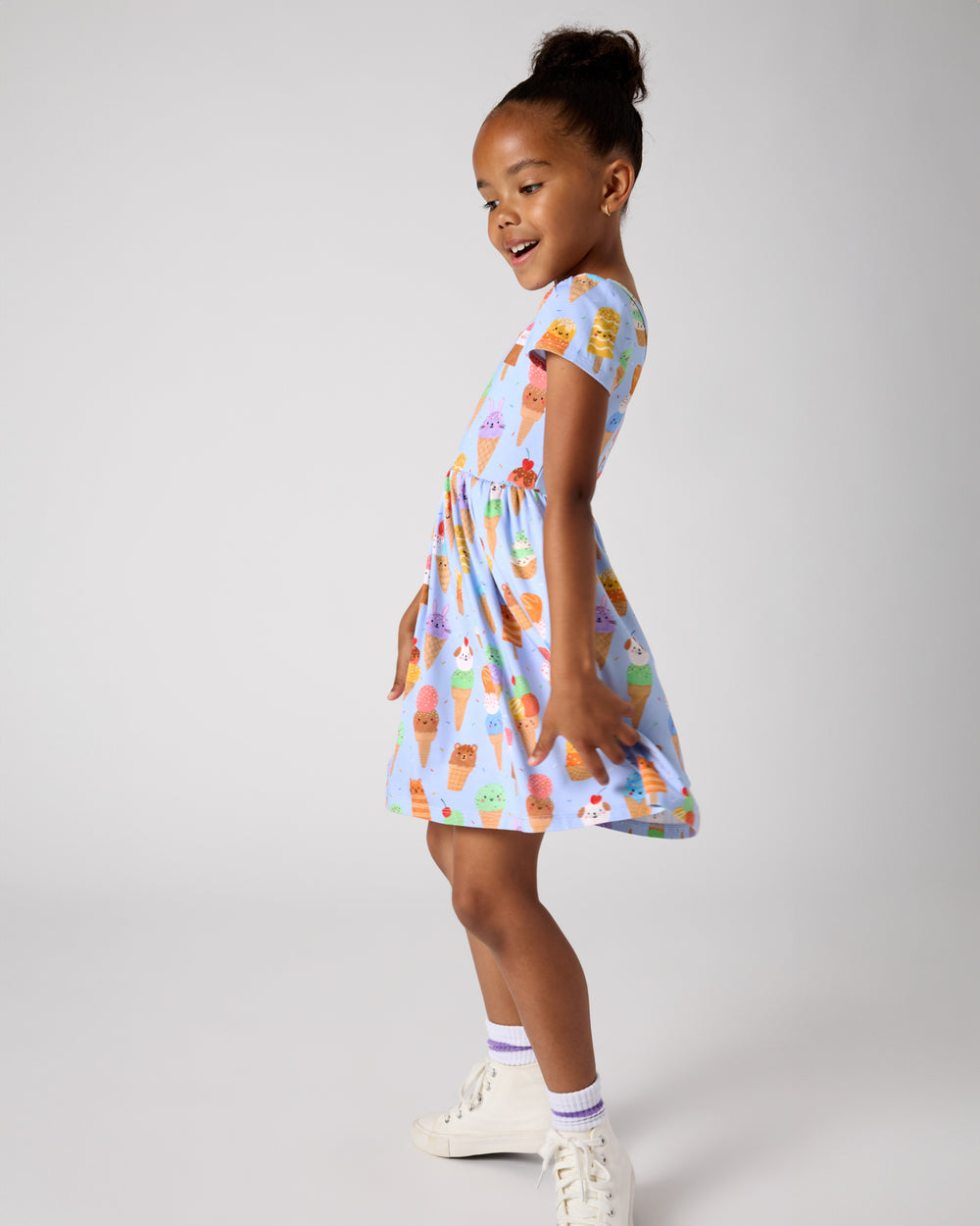 Girl wearing the Scoop Squad Skater Dress